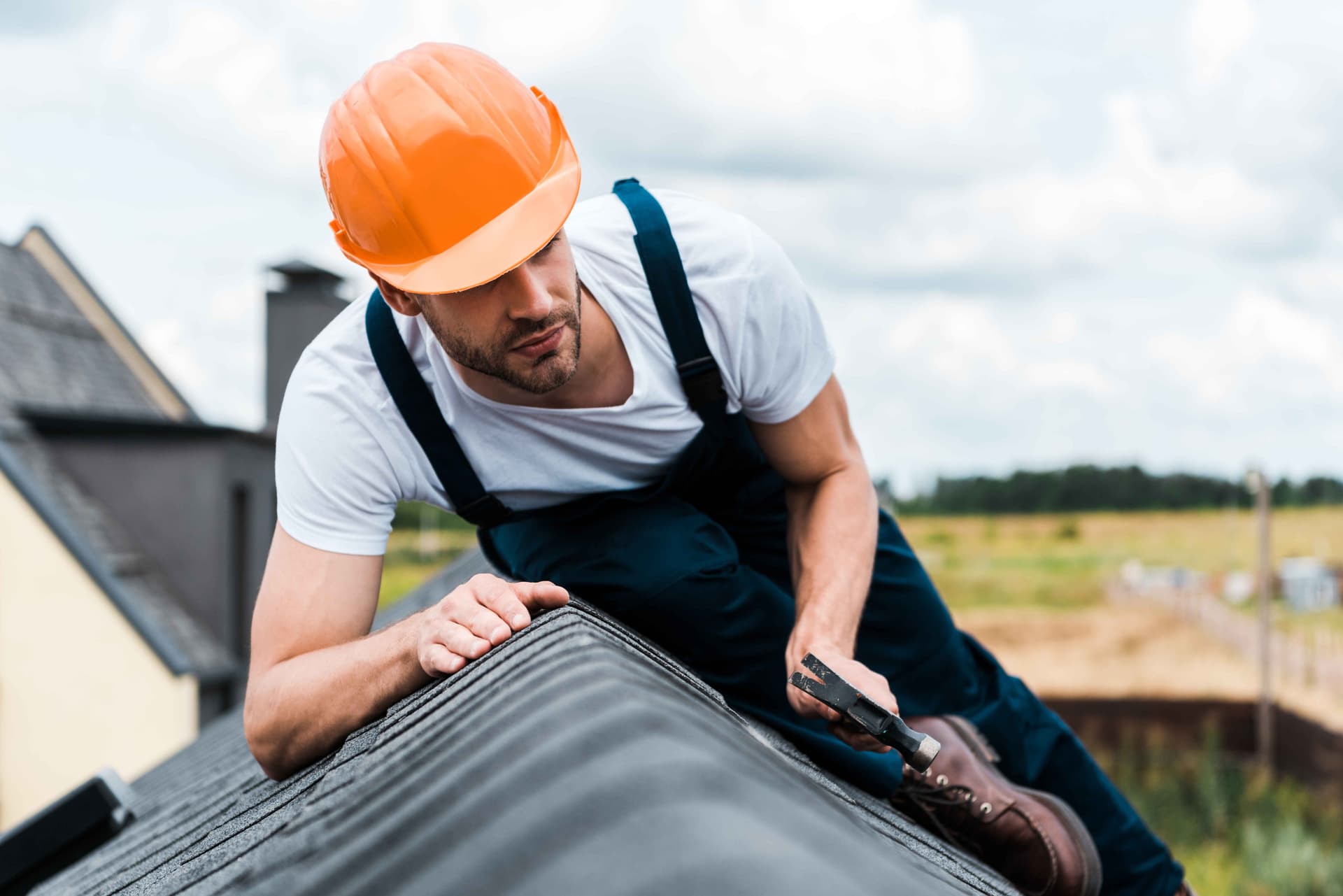 selective-focus-of-repairman-in-orange-helmet-sit,jpg